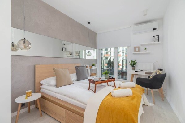Cozy bedroom offers a very comfortable double bed and a place to work or study.