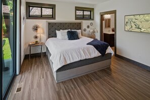 Master bathroom with king bed and patio