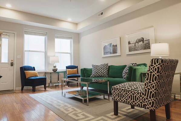 The spacious living room opens onto a lovely courtyard.
