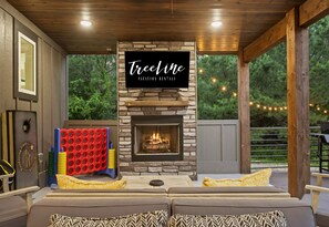 Enjoy the outdoor lounge area with a cozy fireplace and a game of giant Connect Four.