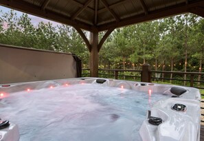 Soak and relax in our outdoor hot tub, surrounded by nature.