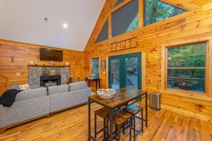 The dining area stretches to the living room and fireplace. 