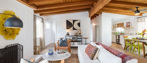 Upstairs living room with large TV and gas fireplace 