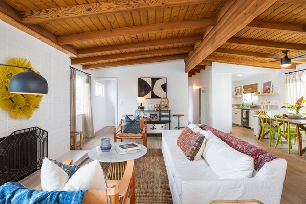 Upstairs living room with large TV and gas fireplace 