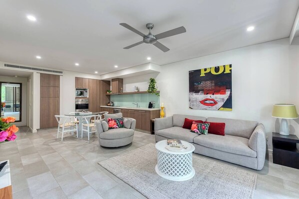 Chic open living is tastefully designed with a touch of metro-style, creating a comfortable and cosy space to come home to.