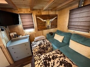 Couch, dresser with three drawers smart  tv (access to all of your accounts ie netflix, apple tv, hulu, prime,)