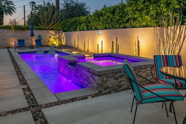 Night time pool and hot tub