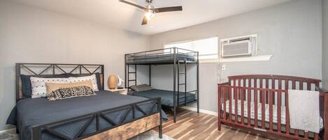 Master bedroom with Queen bed, twin bunk bed and crib