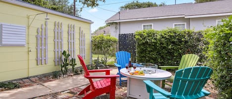 This lovely backyard has it all including a propane fire pit!