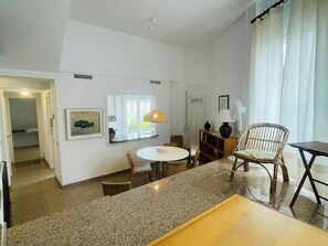 split level living area with open window to the kitchen