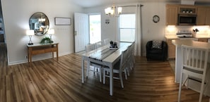 Open concept entry/8 ppl dining/2 bar chairs/living room/kitchen