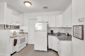 Fully stocked kitchen with all the amenities, fridge, freezer, microwave, toaster, coffee maker and all cookware.