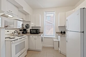 Fully stocked kitchen with microwave, stove, oven, coffee maker, toaster, fridge and freezer. Kitchen comes equipped with all pots, pans, cookware, dishware and flatware.  All the amenities you need to make a great home-cooked meal or a night to order in.