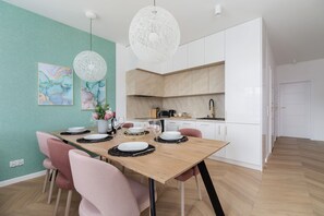 Spacious dining area with fully equipped kitchenette.