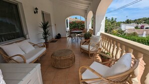 Covered terrace (naya) overlooking the pool and gardens