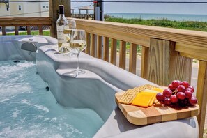 Unwind after a day on the beach in this private hot tub