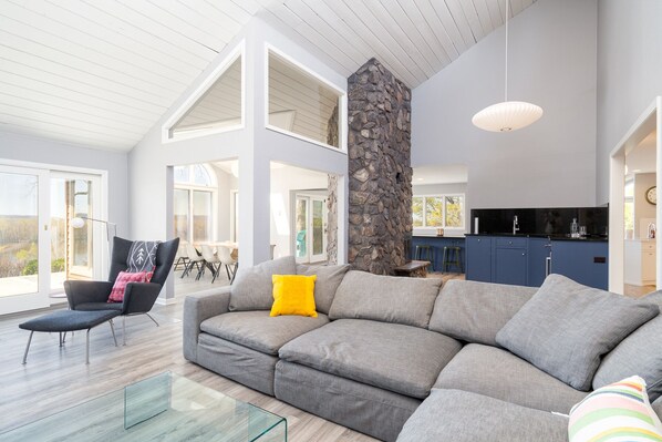 Enjoy the views of nature in this open concept space with large windows(fireplace not for use)