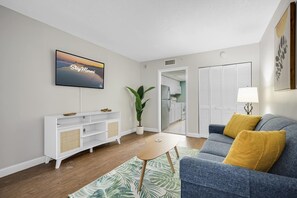 
Unwind in this chic and cozy living room, featuring stylish décor, a plush sofa, and a smart TV for your entertainment. The perfect spot to relax after a day of beachside adventures.