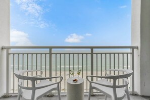 Sip your favorite drink while soaking in breathtaking ocean views from this private balcony. With cozy seating and serene beach vibes, it's the perfect spot to relax and enjoy the coastal breeze.
