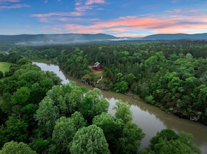 This cabin overlooks mountains, river, eagles soaring and a beautiful forest.