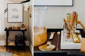 A cool, sleek and modern bar cart with vintage inspired bar tools, glassware, and accessories make for a swanky cocktail hour!