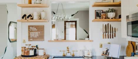 This modern kitchen surrounded by 1800’s charm is as beautiful as it is functional.  The ideal space for foodies, weekend chefs, or experienced take out-ers! 