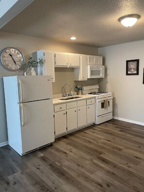 Kitchen is fully equipped with appliances
