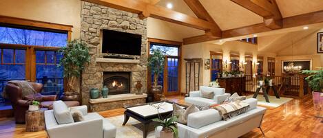 Living room surrounded by windows and wrap-around deck