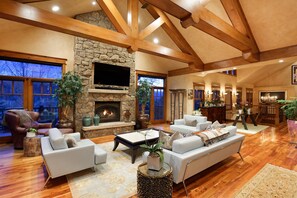 Living room surrounded by windows and wrap-around deck