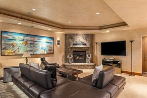 Ground floor additional living area with gas fireplace. The couches fold back to form two twin-sized beds.