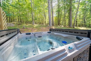 Luxuriate in our hot tub, located out back just off the living room porch.