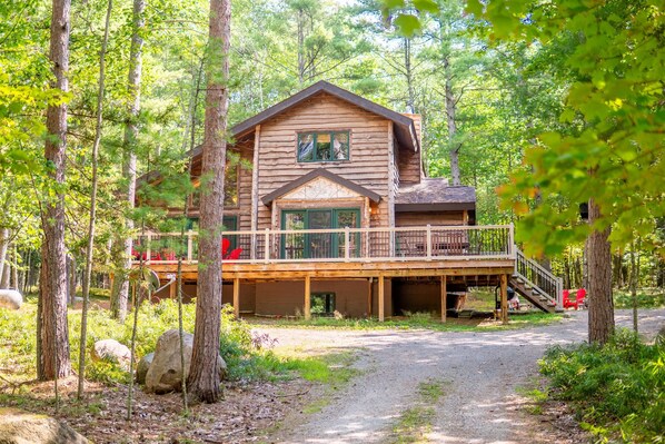 This beautiful vacation home has an expansive deck with plenty of seating for your friends and family. 