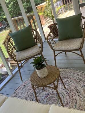 A delightful screened porch for enjoying an evening breeze.
