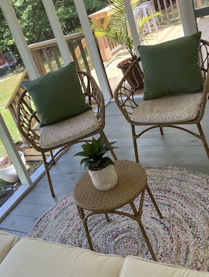 A delightful screened porch for enjoying an evening breeze.