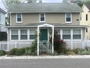 Front door and rose arbor as seen from Main Street.