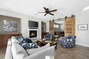 3rd bedroom with two queen beds located behind barn doors