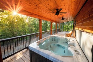 The porch is huge and offers seating, sunset views and the Hot Tub!