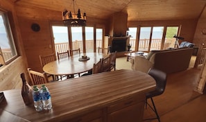 Dining room and living room with views of Lake Michigan