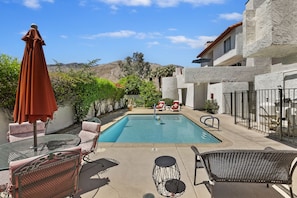 Semi-private pool is steps away. Condo above w/ blue umbrella, spiral staircase