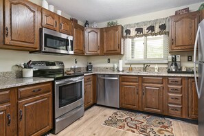 Large kitchen with all your cooking basics perfect for those who want to eat at home.