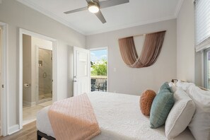 Bedroom 2- queen bed, overhead fan, storage space, en suite bath, rear entry