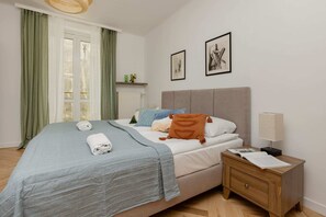 Unique, cozy bedroom with a double bed (can be separated into two single beds) and bedside table.