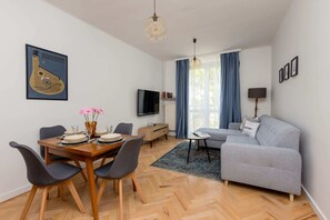 Stylishly and gracefully finished interior of living room with dining area.