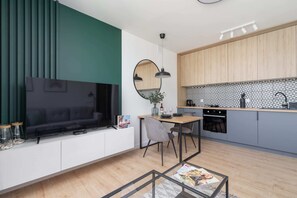 Watch your favorite shows on the flat-screen television in the elegant living area.