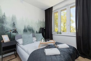 The bedroom features a luxurious double bed.