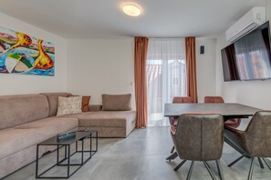 Living room with TV and dining table