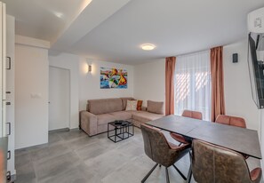 Living room with TV and dining table