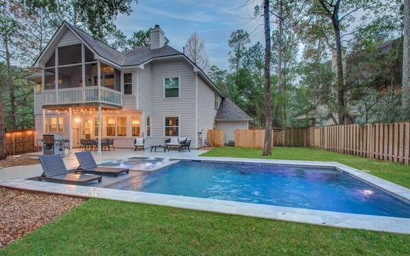 This is the epitome of indoor/outdoor living! Enjoy easy outdoor dining while taking in beautiful views of the backyard pool.