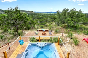 View looking from the deck over the hot tub and fire pit.