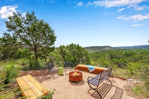 Fire pit and seating area with amazing hill country views.